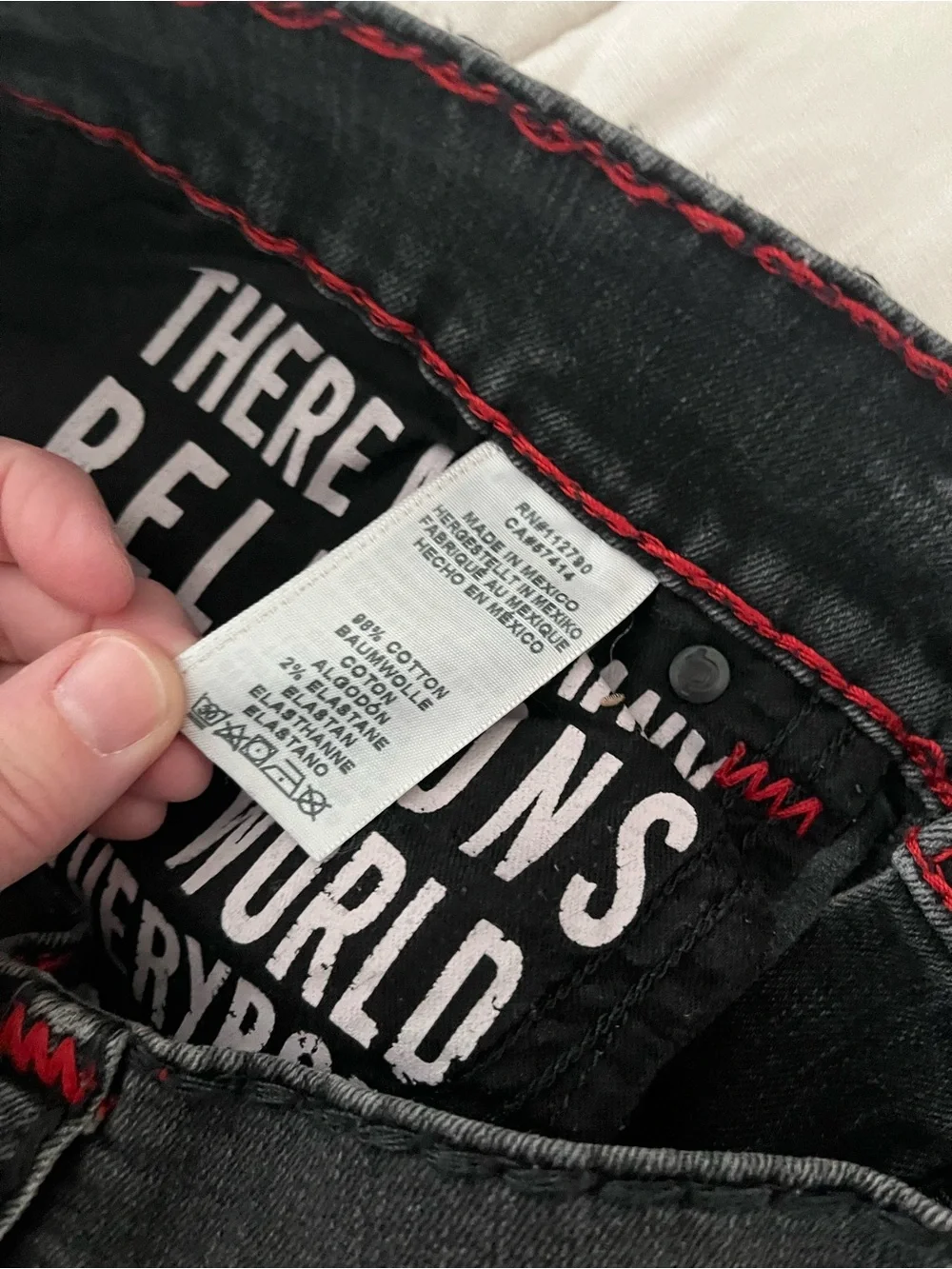True Religion Men’s Black Denim Cutoff Shorts with flaw